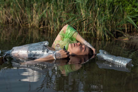 The girl and the problem of ecologyの写真素材