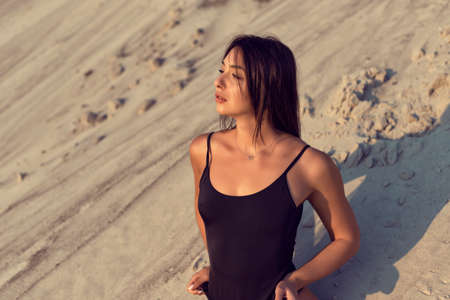 Brunette on vacation in a one piece swimsuit