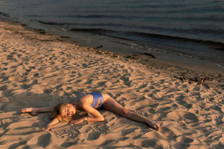 Athletic blonde on the river bankの写真素材