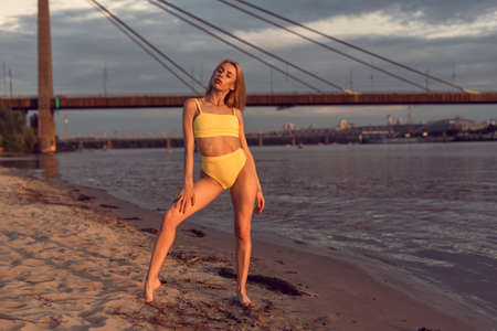 Athletic blonde on the river bankの写真素材