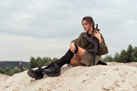 Tanned brunette in the sand dunes