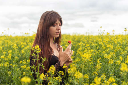 young woman in spring field