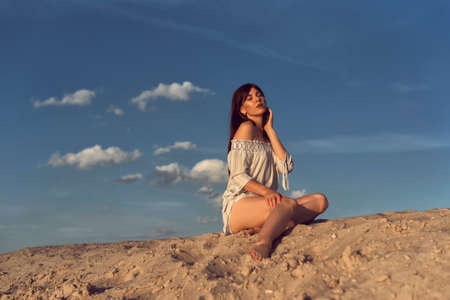 Young brunette woman on a sunny summer dayの写真素材