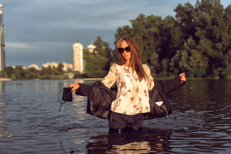 Tanned woman in the city on the coast