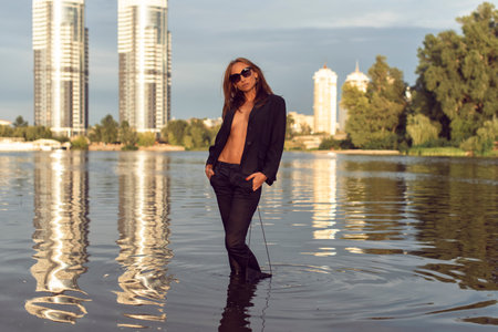 Tanned woman in the city on the coastの写真素材