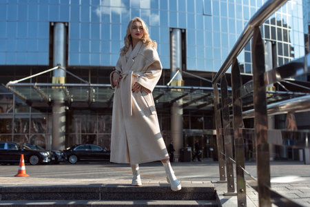 Young blonde woman in autumn cityの写真素材