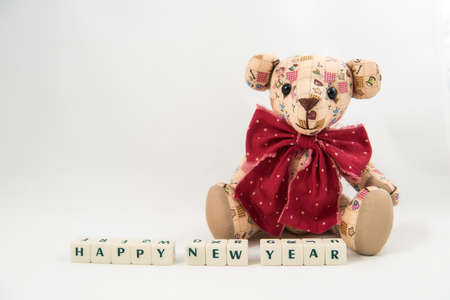 Happy NEW Year white cube text and Teddy bear on white backgroundの写真素材