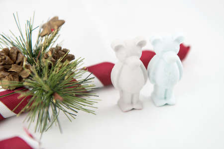 beautiful small plaster bear wishes Merry Christmas. White backgroundの写真素材