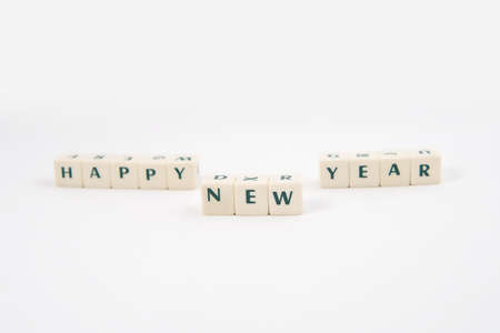 Happy NEW Year white cube text and Teddy bear on white backgroundの写真素材