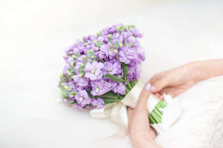 Beautiful wedding bouquet in hands of the brideの写真素材