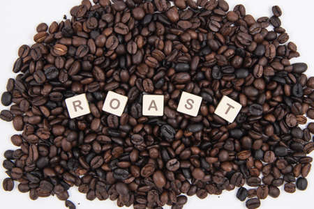ROAST white cube text on white background AND coffee beans background.の写真素材