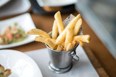 Potatoes fries, Breadsticks in a bucketの写真素材