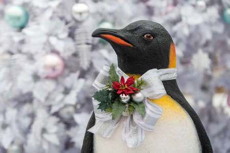 Christmas decoration penguin, Christmas presents on wooden table.の写真素材