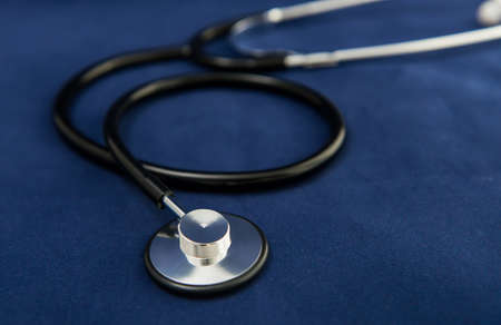 Stethoscope on dark blue backgroundの写真素材