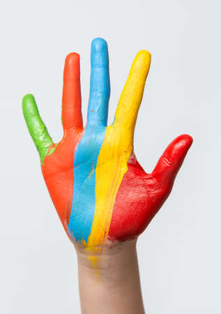 A painted children hand, isolated on white backgroundの写真素材