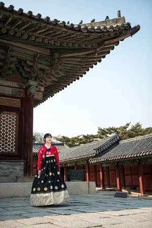 Beautiful Korean girl in Hanbok at Gyeongbokgung, the traditional Korean dress.の写真素材