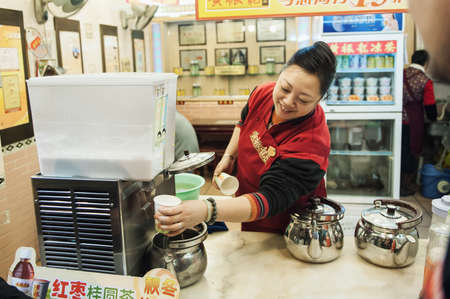 Shanghai, China - December 8, 2011: A small beverage store in Guangzhou, China, sells drinks.のeditorial素材