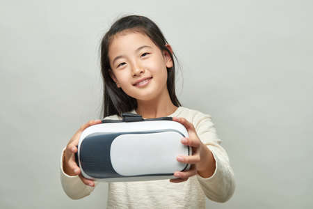 Smiling girl with glasses of virtual reality