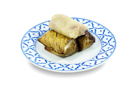 Steamed sticky rice with banana or Khao Tom Mad in banana leaf packaging ,Thai traditional dessertの写真素材