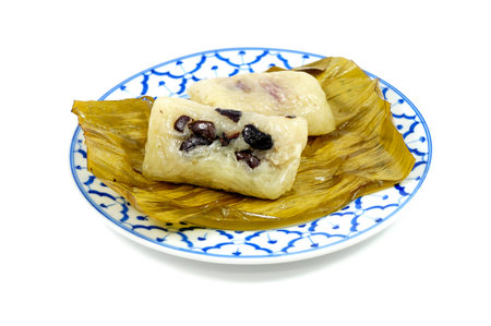 Steamed sticky rice with banana or Khao Tom Mad in banana leaf packaging ,Thai traditional dessertの写真素材