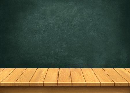 Wood table with blackboard backgroundの写真素材