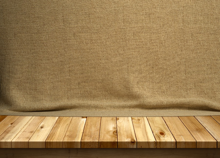 Wood table with brown sackclothの写真素材
