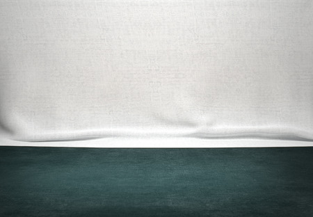 Green wood table with white fabric background
