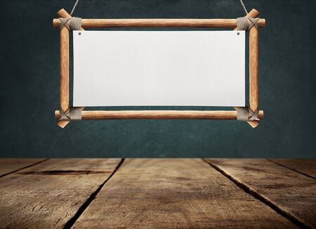 Wood table with hanging wooden signの写真素材