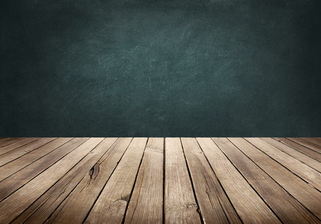 Wood plank table with blackboard backgroundの写真素材