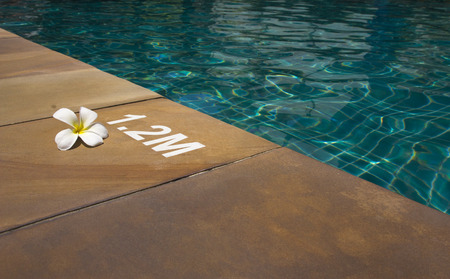 Hotel swimming pool with sunny reflectionsの写真素材