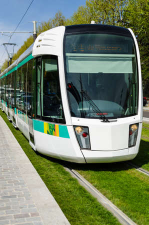 Paris, France - April 5, 2013: Tramway line T3 with green grass,  at the stationのeditorial素材