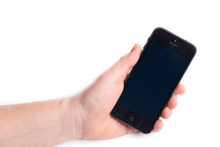 Paris, France - November 11, 2015: Woman holding in the hand an  black iPhone 6 isolated on a white backgroundのeditorial素材