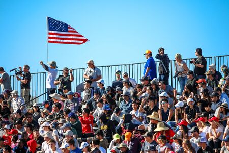Crowd audience in a stadium, group of people looking and taking photos at the event. San Diego, California, USA. September, 09, 2019のeditorial素材