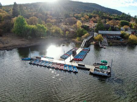 Aerial view of pier with small boat at Lake Cuyamaca, 110 acres reservoir and a recreation area in...
