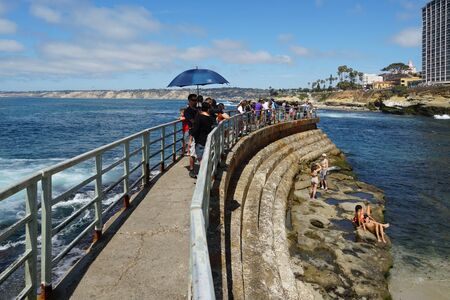 Beachgoers enjoying a beautiful sunny day at La Jolla Cove in San Diego, California, USA. August, 22nd, 2019のeditorial素材