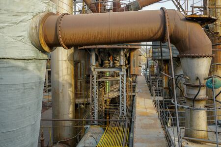 Old Factory metal structures. Industrial plant with old rusty pipes and cooling tower for cooling water supply. Beijing, China. Pollution Conceptの写真素材