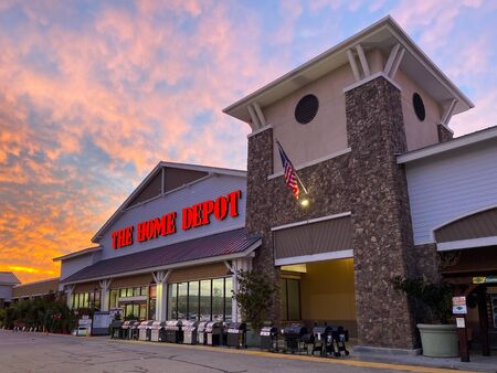 The Home Depot store entrance with colorful sunset in the background in Irvine, California, USA....