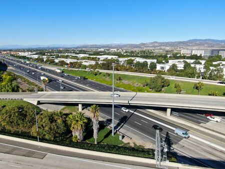 Aerial view of highway transportation with small traffic, highway interchange and junction, San...