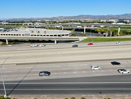 Aerial view of highway transportation with small traffic, highway interchange and junction, San...