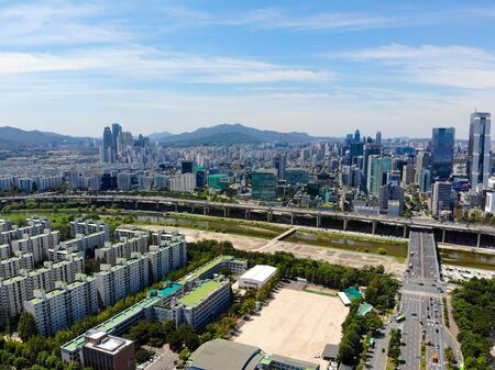 Aerial view cityscape of Seoul, South Korea. Seoul downtown city skyline with river and mountain on...