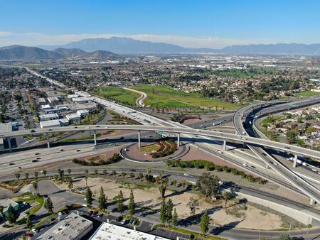 Aerial view of highway transportation with small traffic, highway interchange and junction,...
