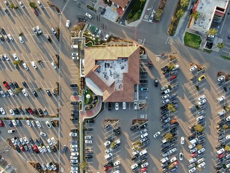 Aerial top view of typical small town shopping center with big parking for car. Rancho Penasquitos,...