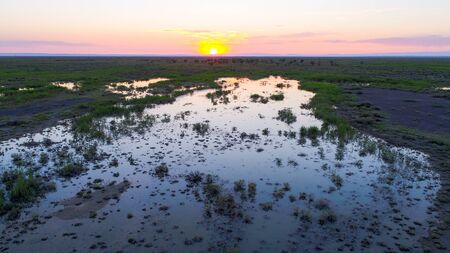 Aerial view of The Ailik Lake during sunset with colorful light. The Ailik or Aylik lake is a lake in Xinjiang Uighur Autonomous Region of China.の写真素材