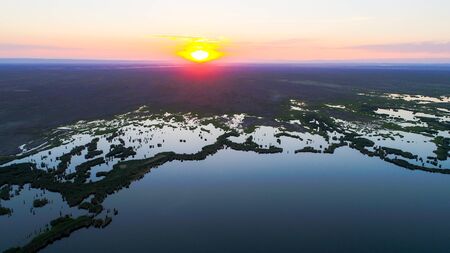 Aerial view of The Ailik Lake during sunset with colorful light. The Ailik or Aylik lake is a lake in Xinjiang Uighur Autonomous Region of China.の写真素材