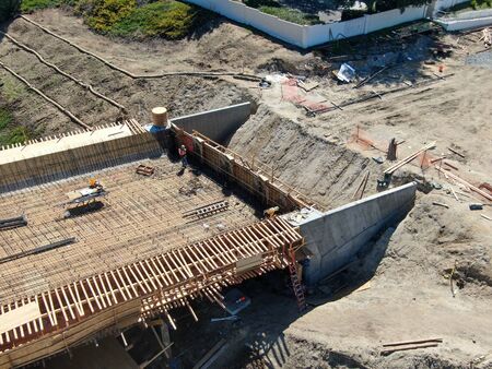 Aerial view of bridge construction crossing the highway, California, USA