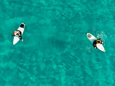 Aerial view of surfers waiting, paddling and enjoying waves in a beautiful blue water in La Jolla, San Diego, California, USA. March 13th, 2020のeditorial素材