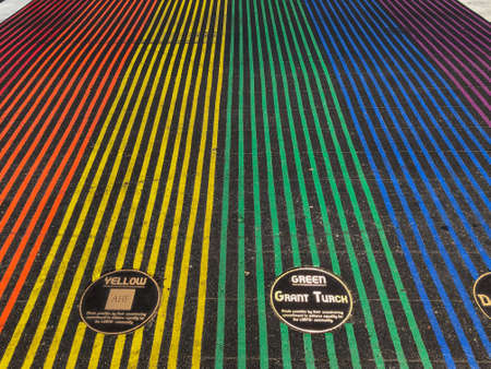 Rainbow gay flag crosswalk in Abbot Kinney Boulevard, Venice, Los Angeles, USA. Colorful pedestrian...