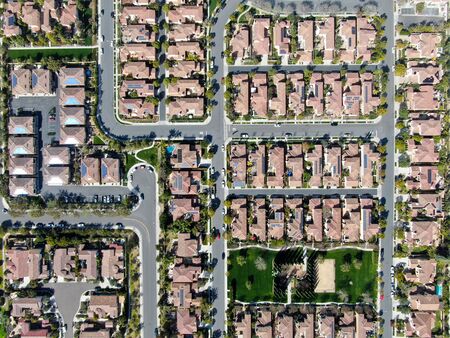 Aerial top view suburban neighborhood with identical villas next to each other. San Diego, California, USA. Aerial view of residential modern subdivision luxury house with swimming pool.の写真素材
