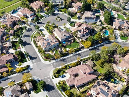 Aerial view suburban neighborhood with identical villas next to each other. San Diego, California, USA. Aerial view of residential modern subdivision luxury house with swimming pool.の写真素材