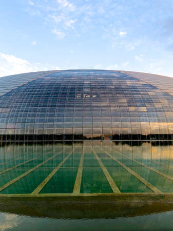 Sunset Panorama with The National Performing Arts Center in Beijing formerly the Beijing National Grand Theater. Futuristic design, one of the most famous landmarks of Beijing, China. July 13th 2019のeditorial素材